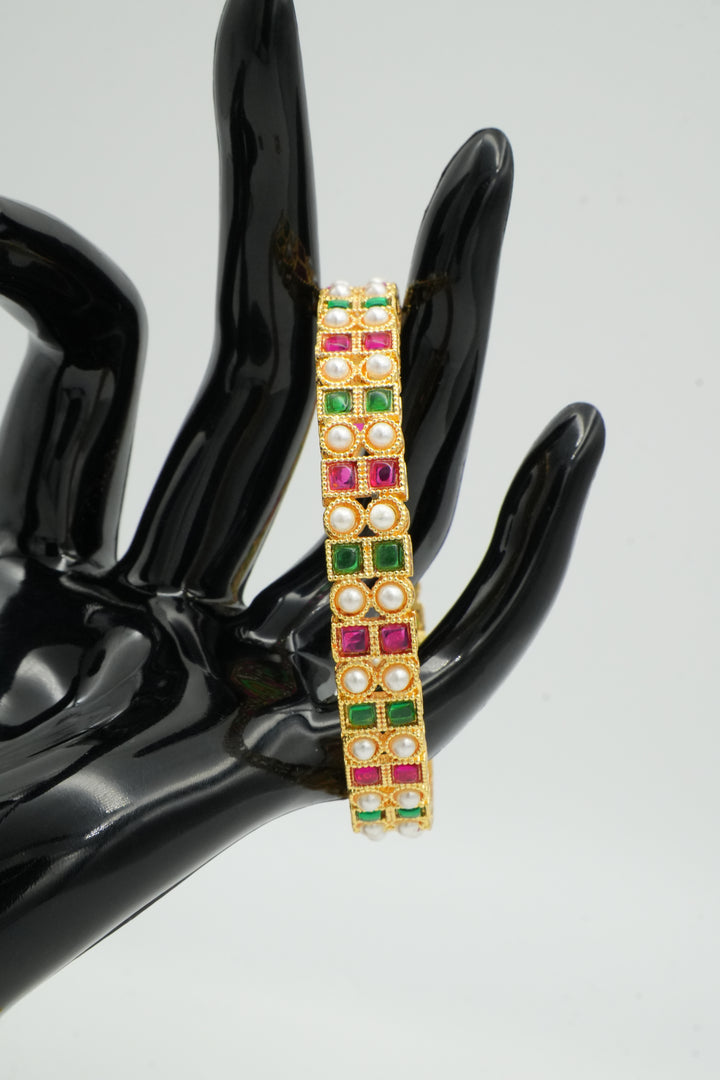 Stylish Gold Bangle Adorned with Pink & Green Gemstones - Victorian Jaipur