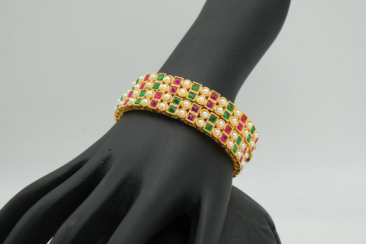 Stylish Gold Bangle Adorned with Pink & Green Gemstones - Victorian Jaipur