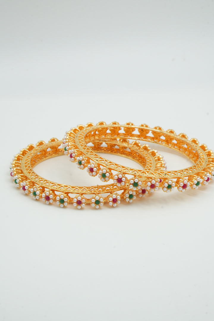 Elegant Gold Bangles Adorned with White Pearl Flowers - Victorian Jaipur