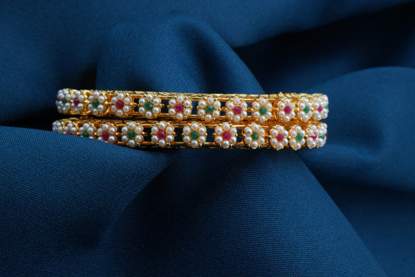 Elegant Gold Bangles Adorned with White Pearl Flowers - Victorian Jaipur